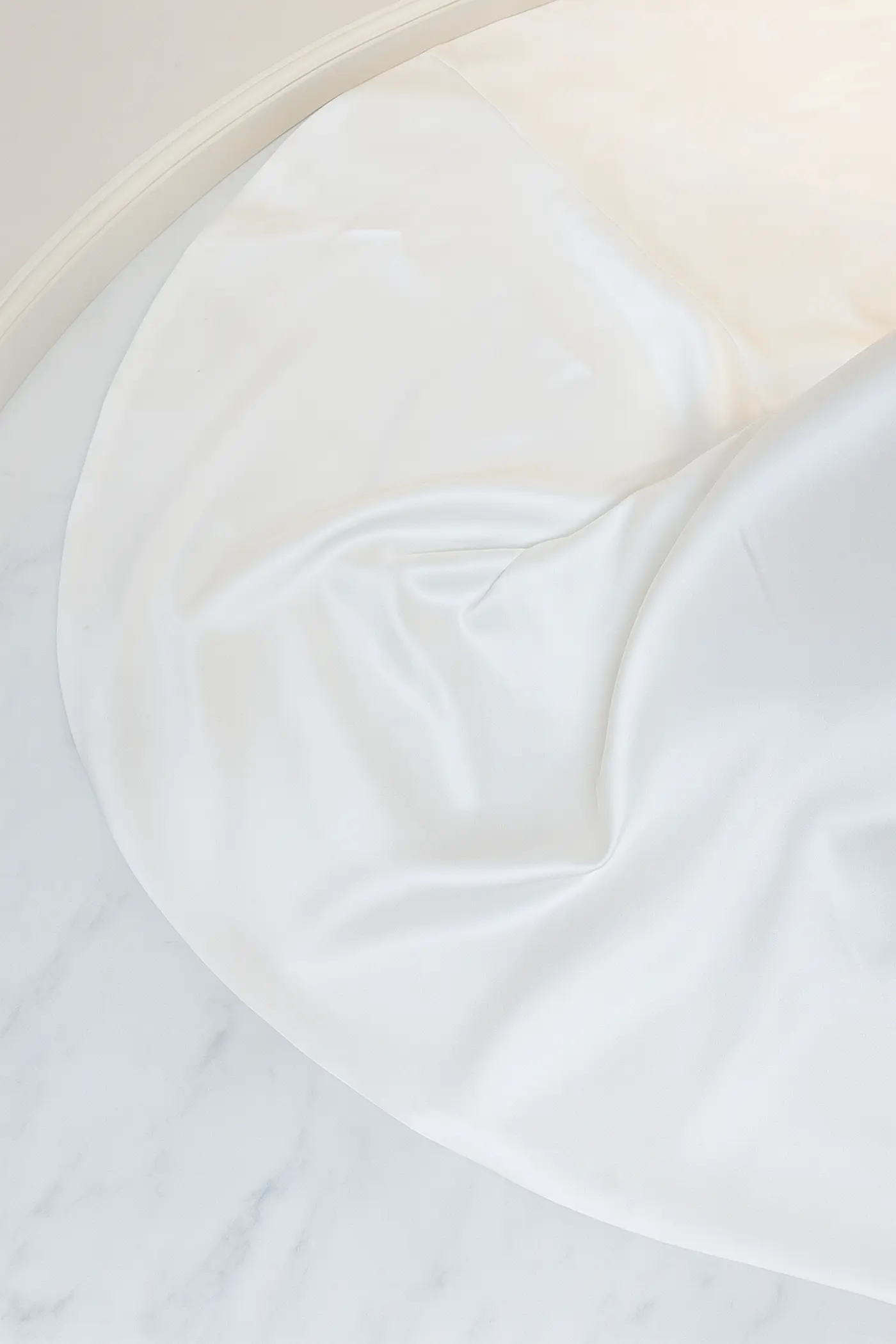 Wedding dress before cleaning with visible dirt and stains