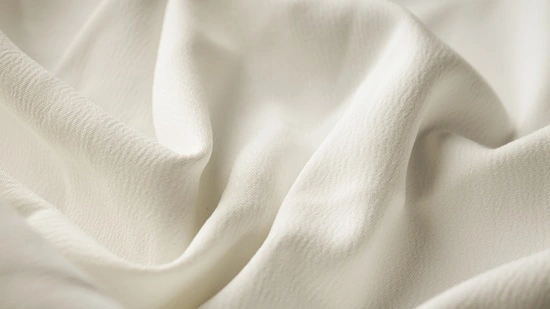 Close-up of bridal crepe fabric showing textured pebbled surface