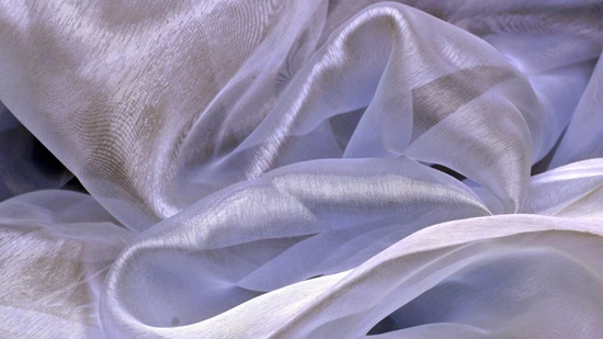 Close-up of bridal organza fabric showing sheer crisp texture