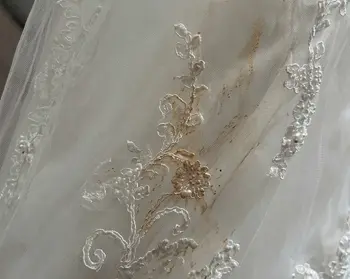 Fake tan DHA stain on white wedding dress bodice before enzyme treatment